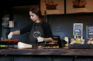 Woman Cooking at a Food Counter